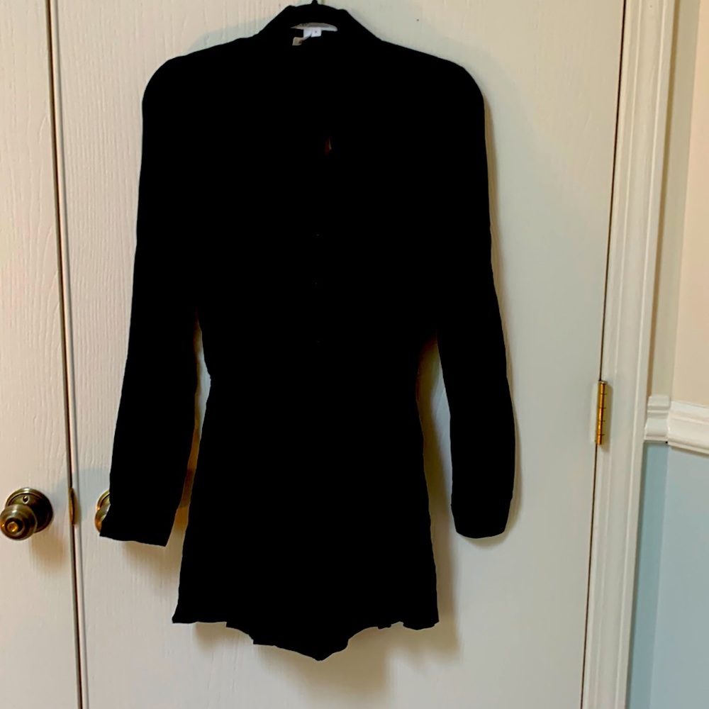 Very cute and never worn, Black BCBG Romper with cut out in the back.